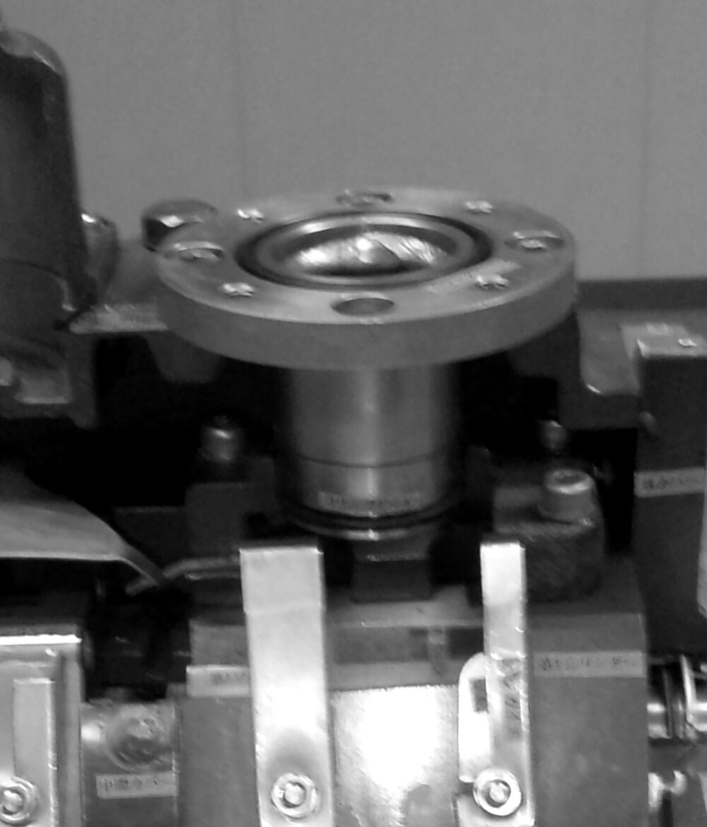 A rotary vane vacuum pump cut open to show the rotor and vanes.